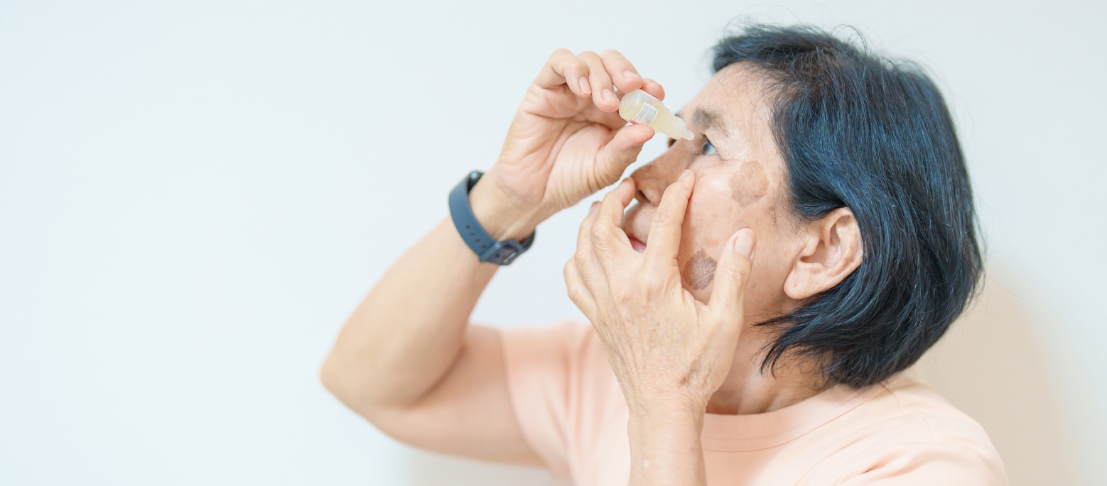 Elderly woman using ophthalmic eye solution